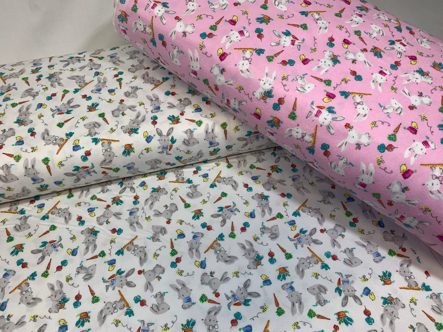 Flannel Bunny Fabric Sold by the YARD. 100% Cotton Easter Fabric. White Rabbits on Pink, Green Accents. For Quilts, Clothing, Nursery Décor.