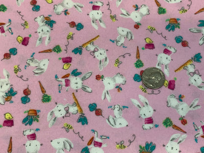 Flannel Bunny Fabric Sold by the YARD. 100% Cotton Easter Fabric. White Rabbits on Pink, Green Accents. For Quilts, Clothing, Nursery Décor.